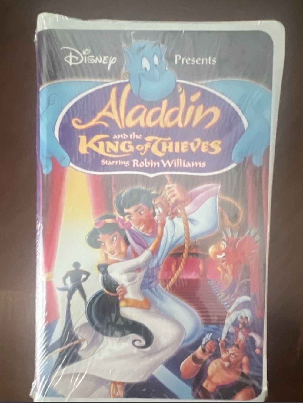 Disney Aladdin and the King of Thieves Cover — Purple, Blue, Red, Gold